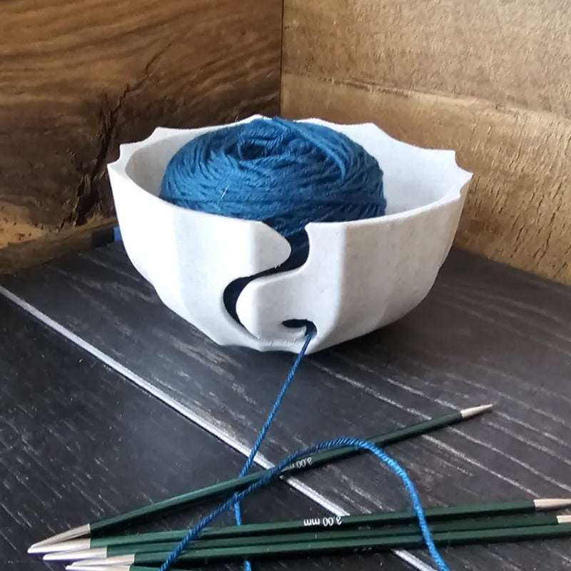 A 3D-printed yarn bowl to accompany your knitting and crochet time. White.