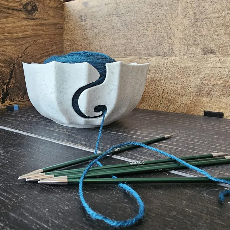 A 3D-printed yarn bowl to accompany your knitting and crochet time. White.