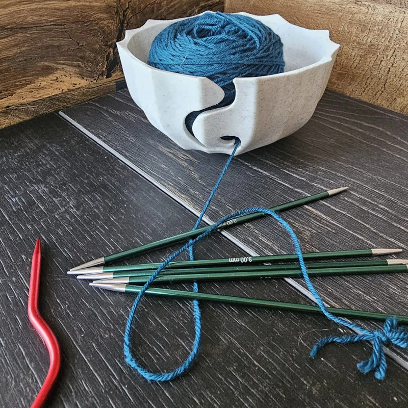 A 3D-printed yarn bowl to accompany your knitting and crochet time. White.