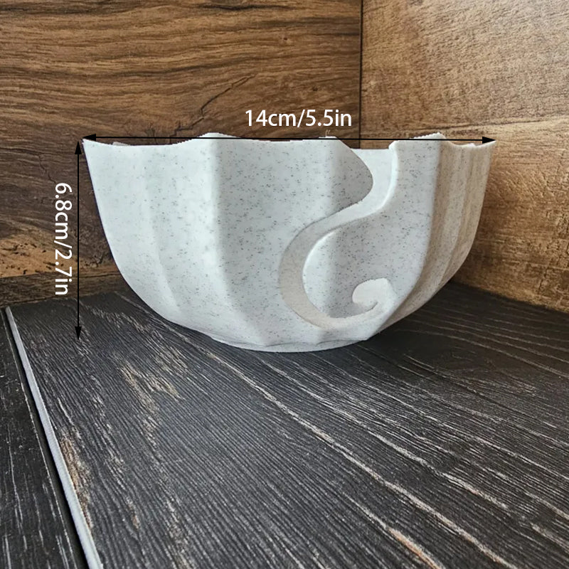 A 3D-printed yarn bowl to accompany your knitting and crochet time. White.