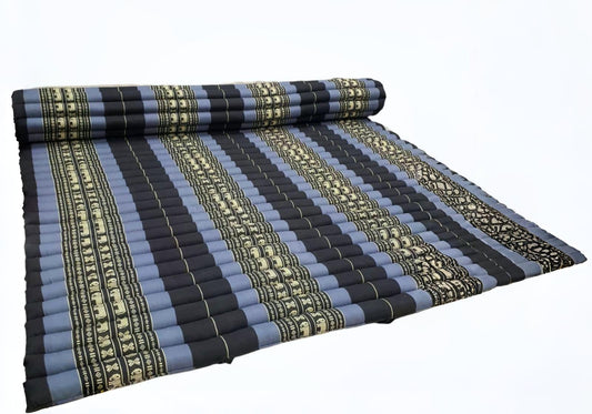 Rolled-up striped mat with blue, black, and beige pattern on a white background